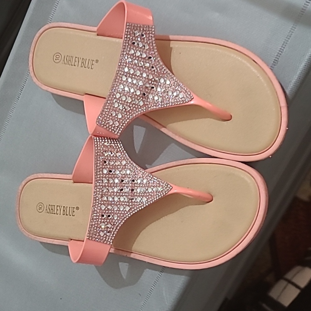 Coral pink flip flops